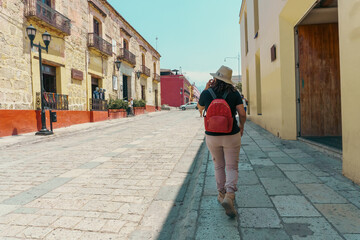 Tourist woman holding a phone in Oaxaca city, Mexico