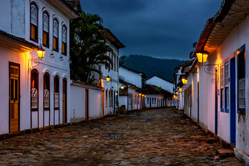 Streets and houses of the historic city of Paraty in the state of Rio de Janeiro illuminated at...