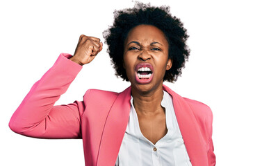 African american woman with afro hair wearing business jacket angry and mad raising fist frustrated...