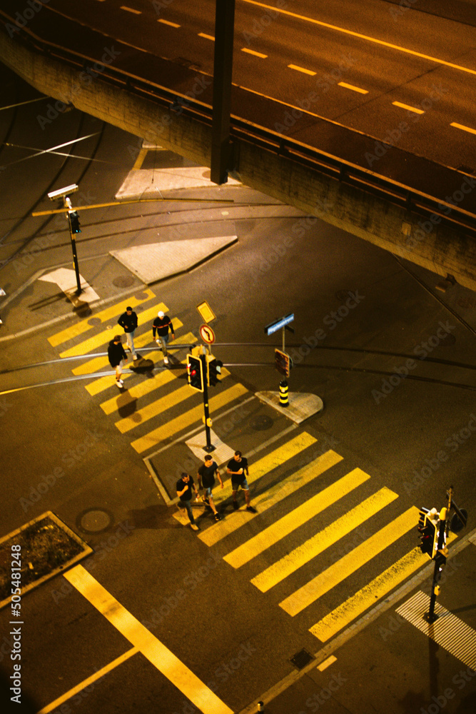 Canvas Prints areal view of people crossing the street at night