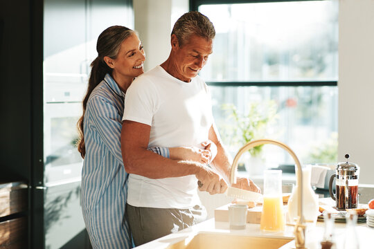 Loving couple making breakfast in the morning