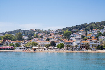 view on a small village on an island with blue water in fron (Istanbul)
