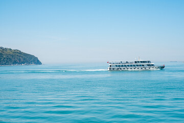 a ferry shipping away from an island near to istanbul