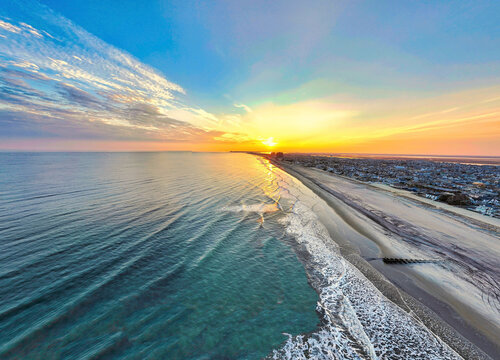 Beautiful view of an ocean with sunset in the background in Margate City, New Jersey