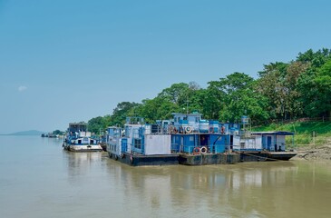 Fototapeta na wymiar Passenger ferries moored along the banks of the Brahmaputra river