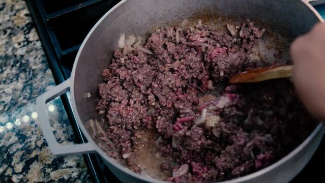 ground beef onion garlic sautee spoon