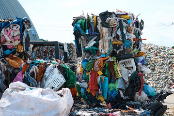 Pack of plastic materials in recycling plant yard - obrazy, fototapety, plakaty