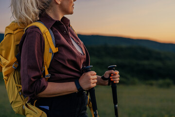 Woman with backpacker and hiking poles