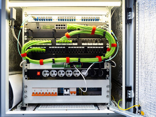 Electrical network equipment. Network equipment with fiber optic and wires. Electrical cabinet with...