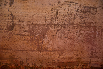 flat surface painted unevenly with warm colors 