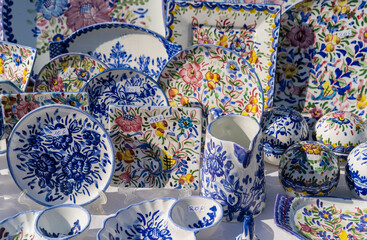 Background with colorful Portuguese blue ceramics, local handicrafts, plates from Porto city.