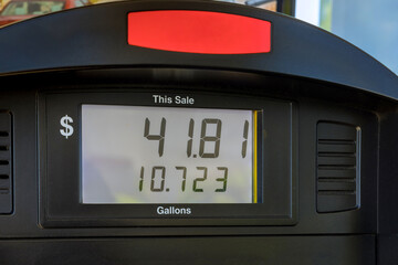 Digits counter of petrol pump by gasoline station with high rising gas prices