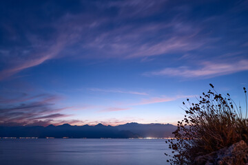 Fototapeta na wymiar Dusk and dawn landscape. Beautiful Antalya sea bay at evening time.