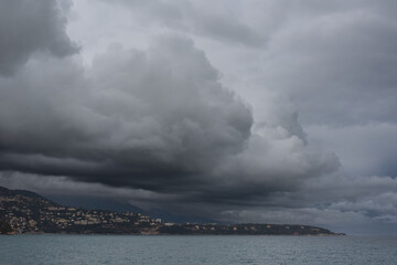 Storm clouds above the town on the shore. Monte Carlo, Monaco.