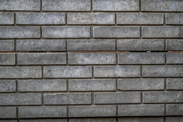 Gray brick wall texture of a building