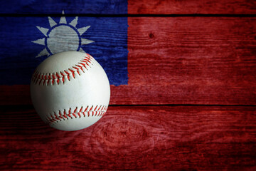 Leather Baseball on Rustic Wooden Background Painted With Taiwanese Flag. Taiwan or Chinese Taipei is one of the world's top baseball nations.