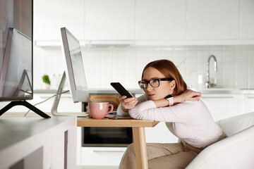 Woman watching tv, using remote control,  channel surfing, getting information and latest news,...