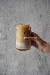 Hand with Ice coffee glass, close-up - obrazy, fototapety, plakaty