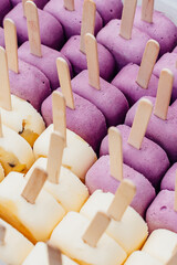 popsicles on a stick, lots of purple ice cream, handmade sweets, summer dessert, ice cream with wooden sticks on top
