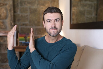 Man showing that something is big with hand gesture