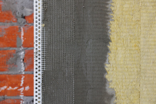 Close-up of external wall insulation systems and facade cladding.