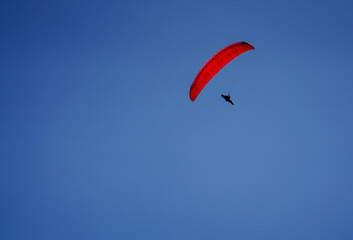 paragliding in the blue sky