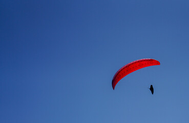 paragliding in the blue sky