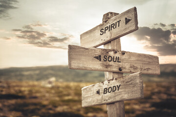 spirit soul body text quote caption on wooden signpost outdoors in nature. Stock sign words theme.