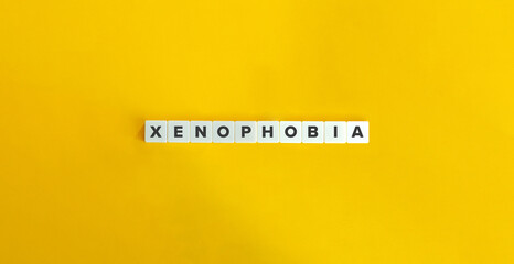 Xenophobia Banner. Letter Tiles on Yellow Background. Minimal Aesthetics.