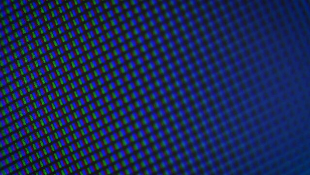 Smooth abstract multicolored glow of RGB pixels close-up, soft focus for background