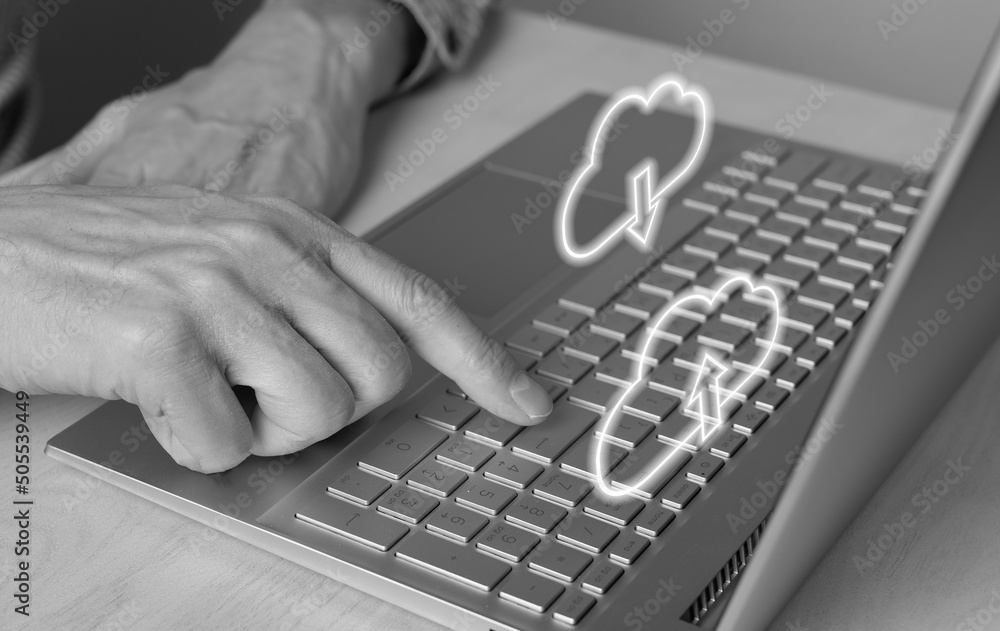 Poster cloud computing. man using laptop for download files from online storage. forefinger closeup pressin