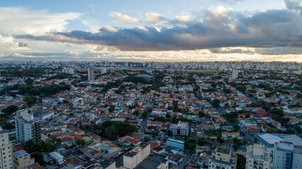 Fototapeta na wymiar Aerial view of Sao Paulo at sunset with Congonhas Airport in the background. In the neighborhood of Planalto Paulista