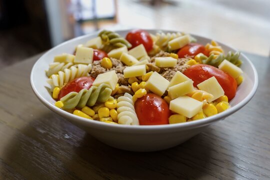 Pasta Salad With Tricolor Ferns, Tuna, Tomato, Cheese, Olives, Corn, Can Be Dressed With Mayonnaise Or Olive Oil.