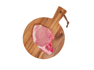 Raw pork steak on wooden cutting board.