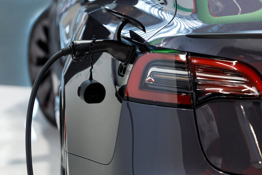 Electric car charging battery energy in station.