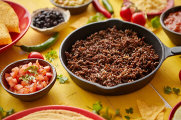 Various fresh and tasty ingredients for chilli con carne. With meat on iron pan