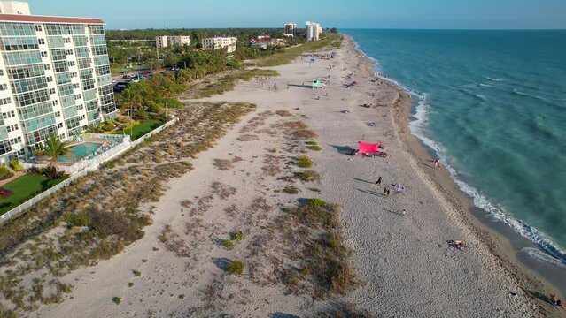 Venice beach Florida near Sarasota and Fort Myers. Panorama of Florida city. Flying on drone over Venice beach FL. Gulf of Mexico beach. Summer vacation. View on Residential house, Hotels and Resorts.