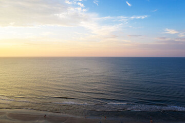 Aerial view of sunset at sea, waves and beach on Hilton Head Island, South Carolina