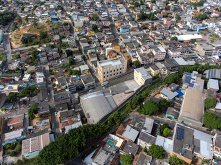 Obraz premium Slum favela-style community city on the outskirts of Vitoria, Cariacica, Espirito Santo - aerial drone view