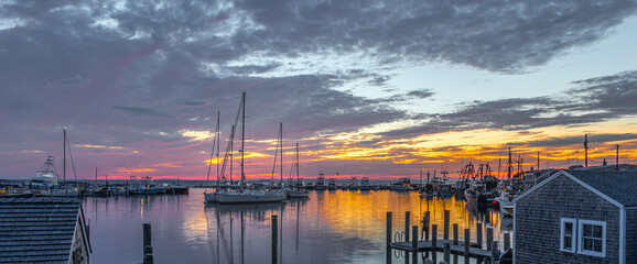 Panoramic shot of sailboats in harbor at scenic sunset in Martha's Vineyard, Massachusetts, USA