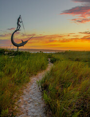 Harpoon statue sculpture at sunset by the beach on Martha's vineyard in New England