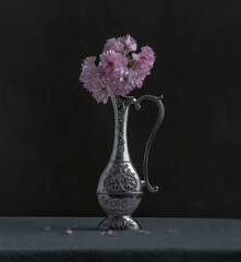 sacura branch  in the silver vase