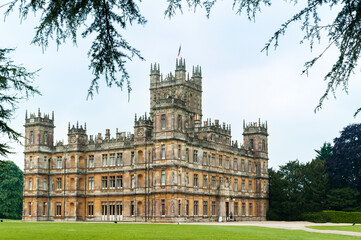 NEWBURY, HAMPSHIRE, ENGLAND - MAY 27 2018: Highclere Castle, a Jacobethan style country house, home of the Earl and Countess of Carnarvon. Setting of Downton Abbey - UK - obrazy, fototapety, plakaty
