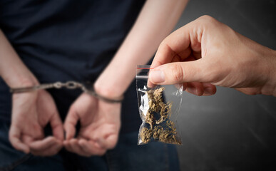 Drug package with hemp. Arrested man in handcuffs