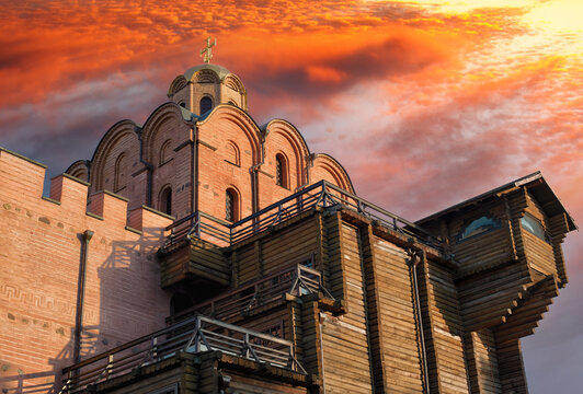 Ancient Golden Gate with a dome of Annunciation Church in Kiev against a dramatic evening sky. Capital of Ukraine - Kyiv city