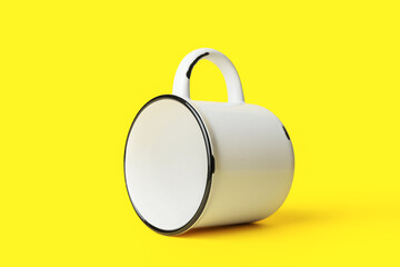 Ceramic cup on yellow background