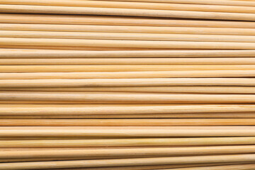 Texture of wooden skewers as background, closeup