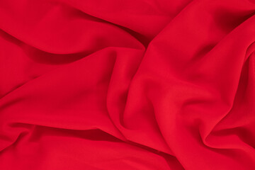 Obraz premium Red silk or satin fabric texture can use as abstract background.Top view.