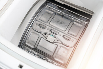 Closed drum of the washing machine. Completed washing cycle.