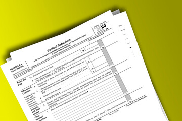 Fototapeta premium Form 1040-NR (Schedule A) documentation published IRS USA 44501. American tax document on colored